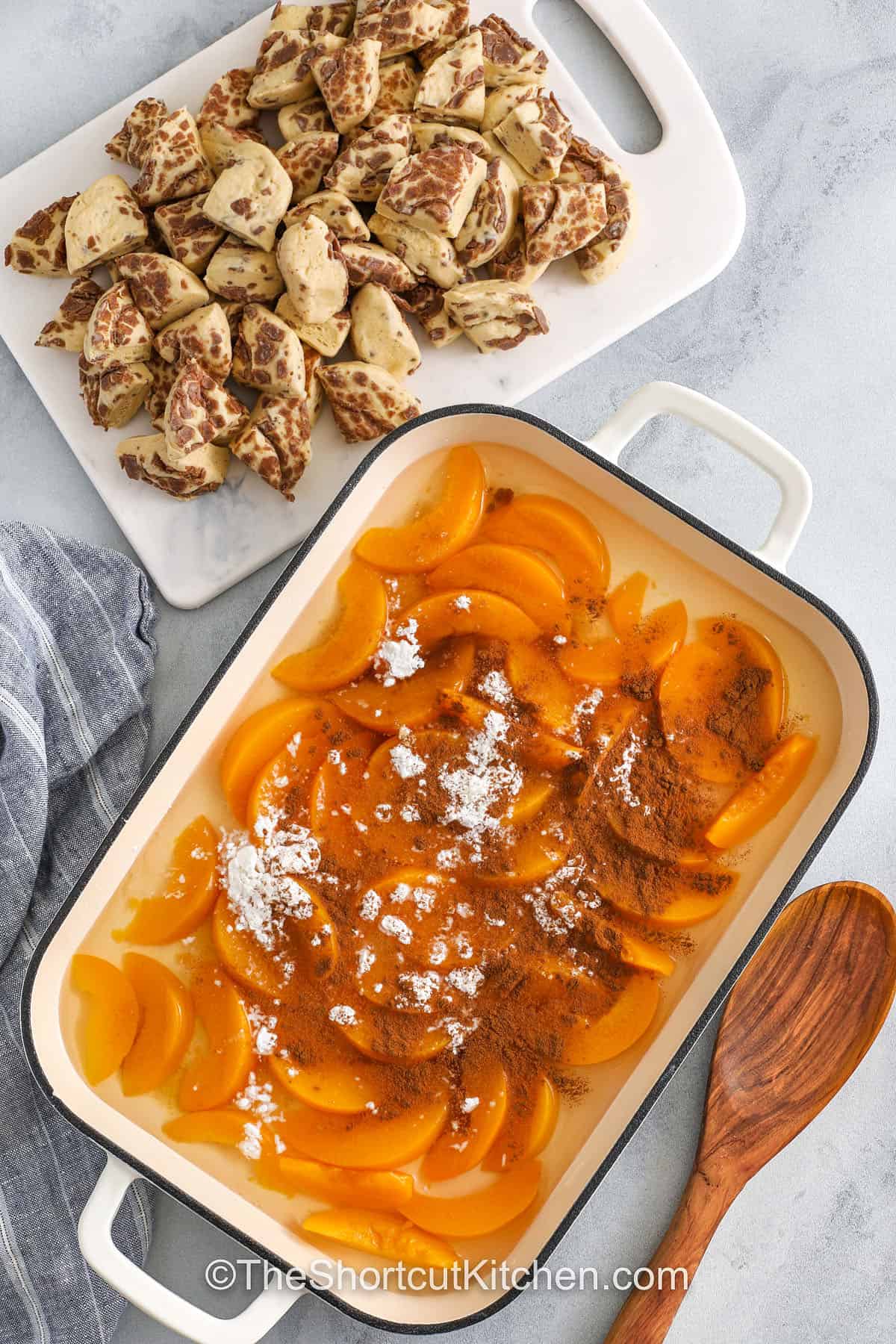 adding flour , brown sugar and cinnamon to dish to make Cinnamon Roll Peach Cobbler