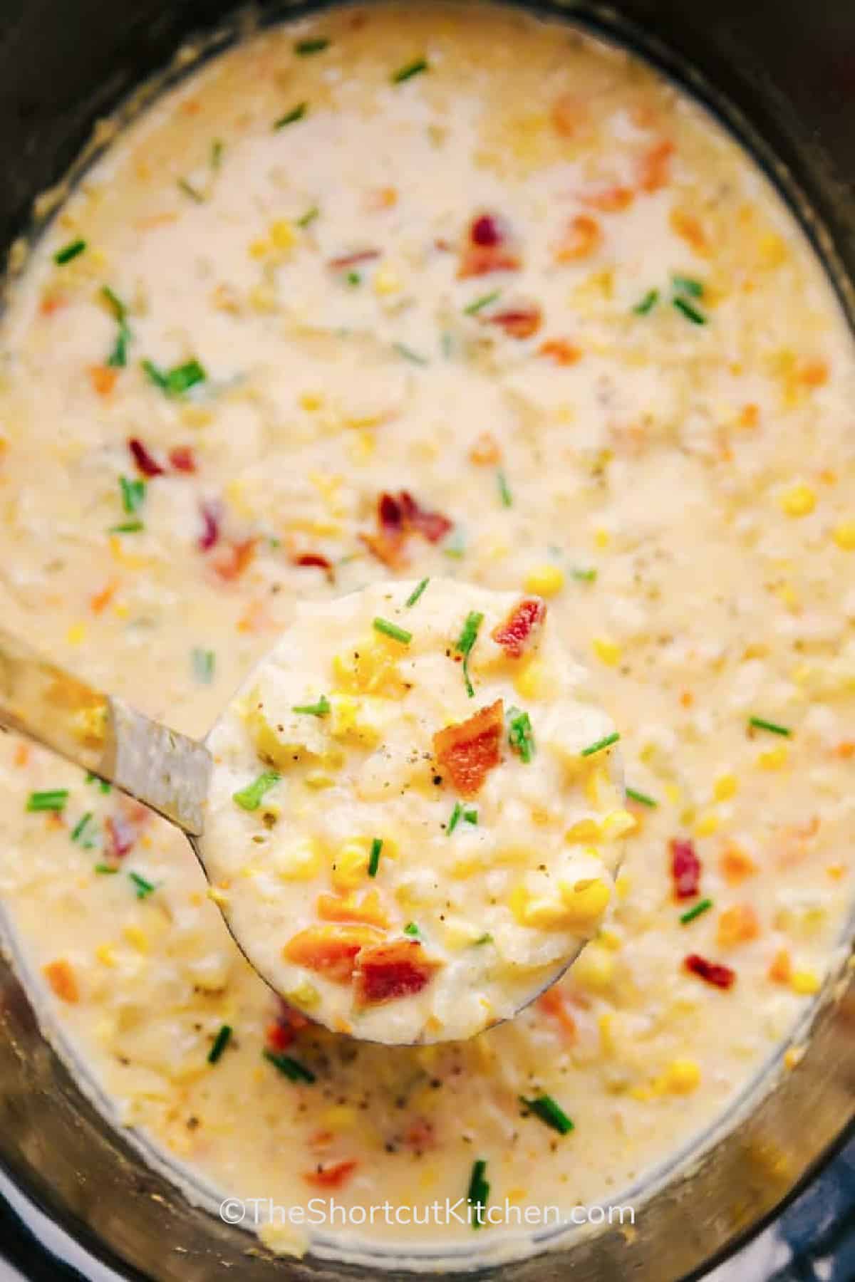 Crockpot Corn Chowder in a crockpot with a ladle scooping some out