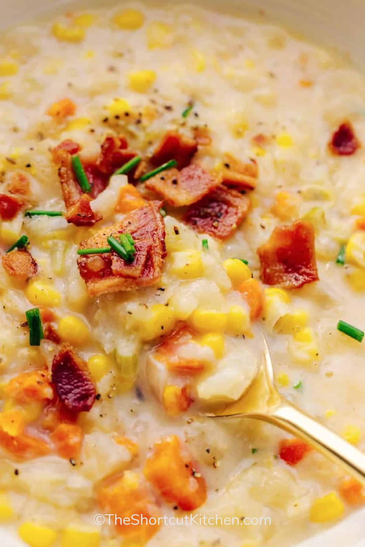 Crockpot Corn Chowder in a bowl with a spoon scooping some out