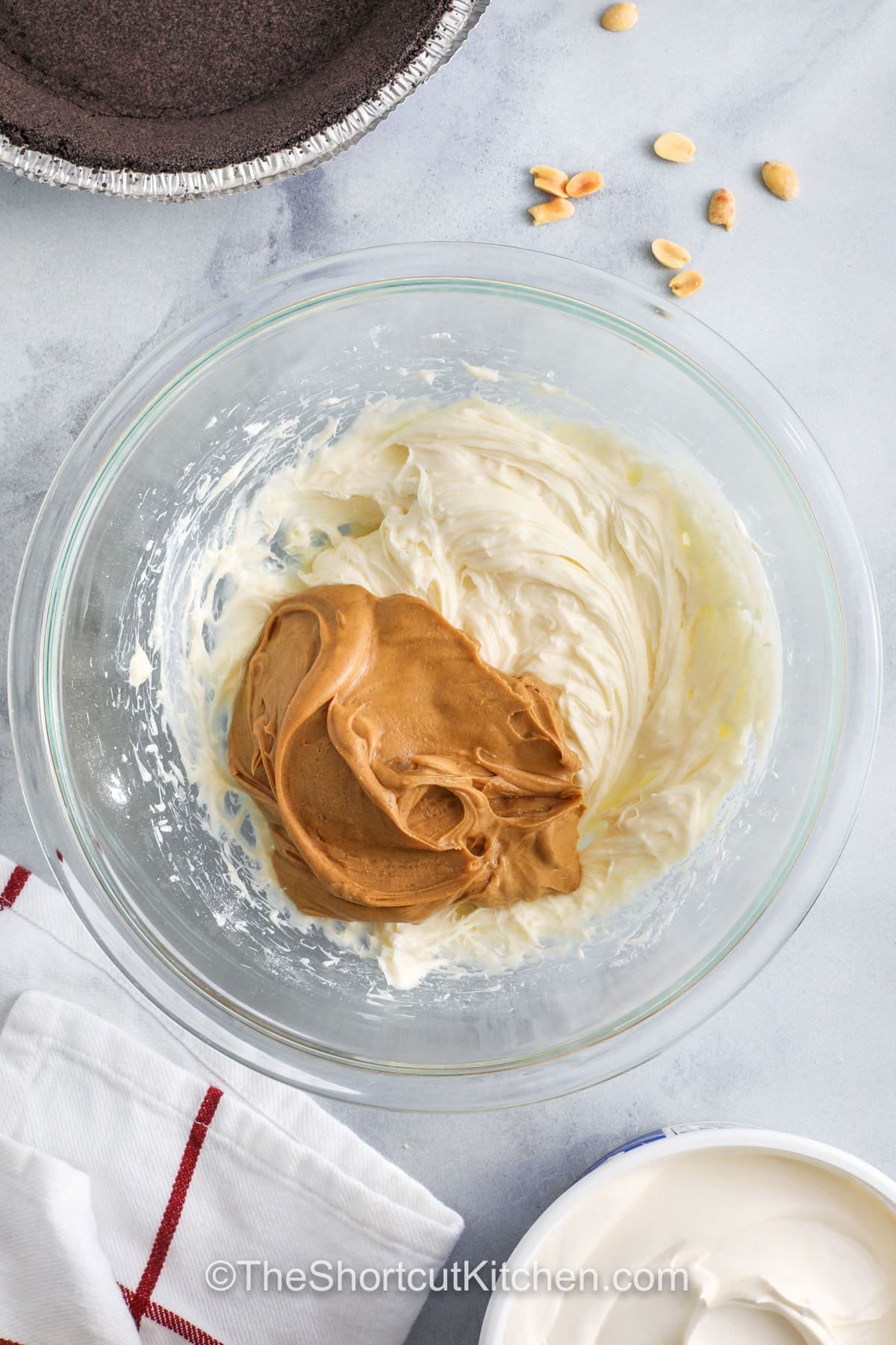 adding peanut butter to whipped topping to make Peanut Butter Pie