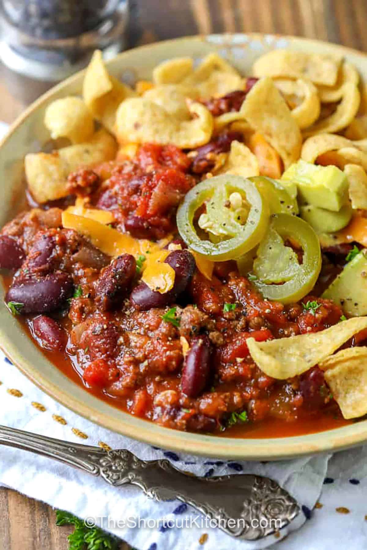 Easy slow cooker chili is hearty, flavorful, and so simple to make. With beef, beans, and colorful vegetables simmering in a tomato-rich sauce, it’s the perfect combination of homemade comfort and easy prep. This crockpot recipe is one you’ll come back to again and again because it’s just that good. Each bowl is warm, satisfying, and full of flavor, making it the best comfort food for any season. #theshortcutkitchen bowl of Easy Slow Cooker Chili