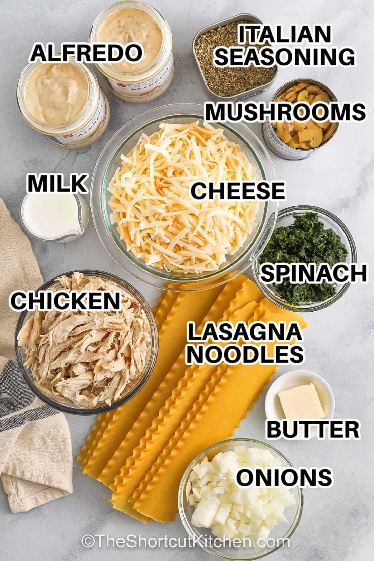 alfredo , milk , chicken , cheese , mushrooms , italian seasoning , spinach , lasagna noodles , butter , onions with labels to make Chicken Alfredo Lasagna Recipe