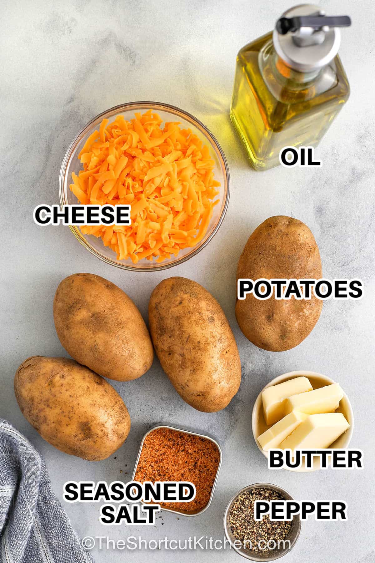 Try this Hasselback potatoes recipe for an easy side dish that’s crispy, cheesy, and full of flavor. Potatoes are thinly sliced, layered with garlic butter, and oven-baked until the edges are crispy and the center is creamy. Add bacon and cheese between the slices to make them the best holiday treat. Serve at dinner with your favorite main or let them shine on their own. #theshortcutkitchen. cheese , potatoes , oil , butter , pepper , seasoned salt and lables to make Hasselback Potatoes Recipe