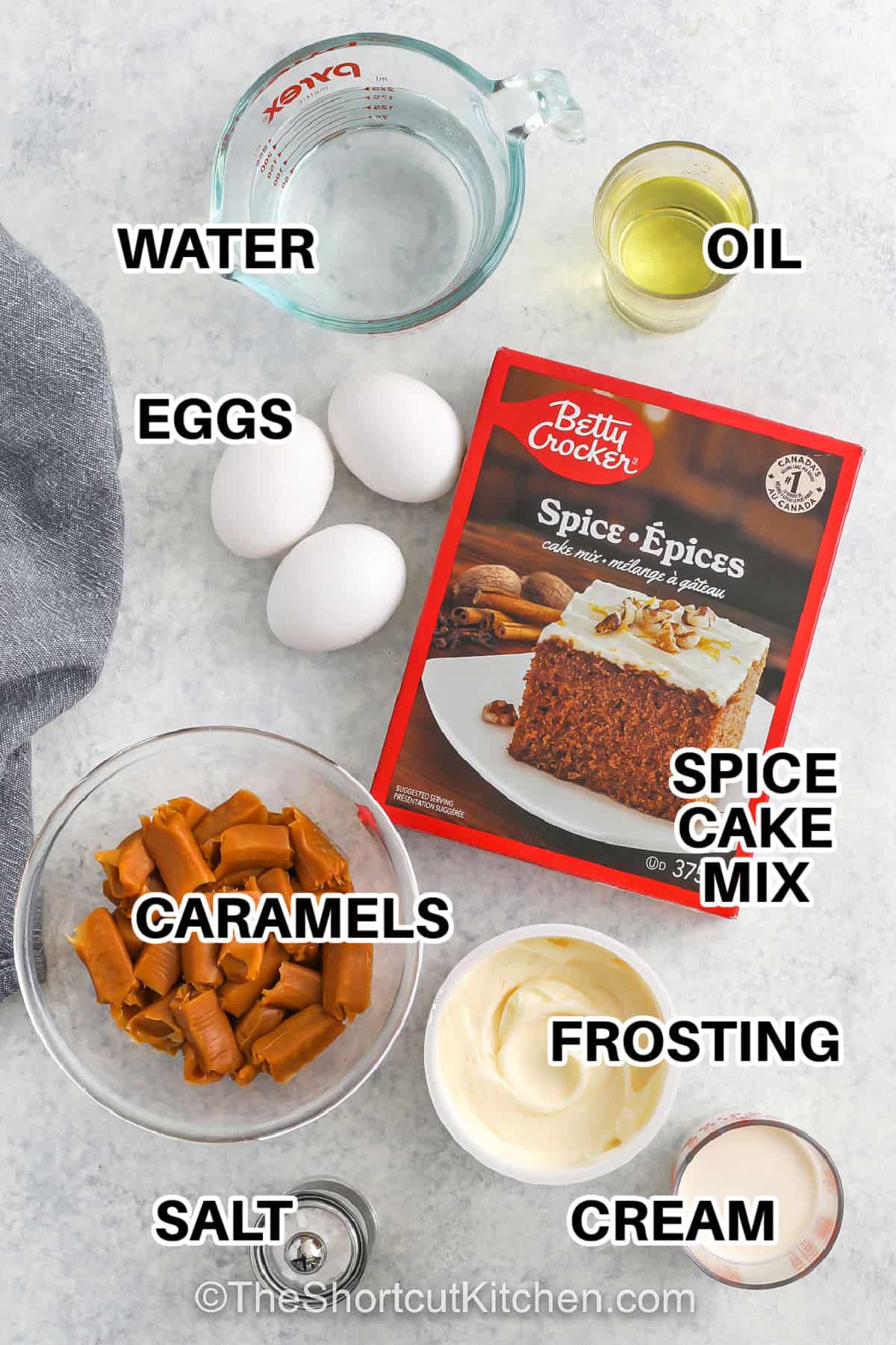 water , eggs , oil , spice cake mix , frosting , cream , salt and caramels to make Salted Caramel Cupcakes
