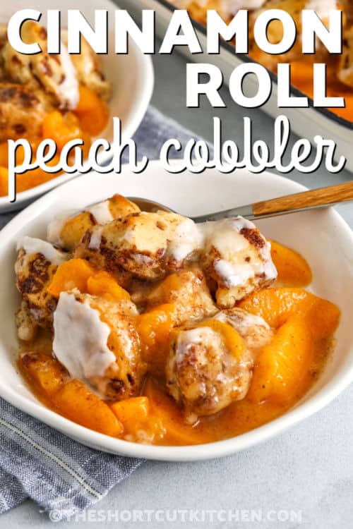 close up of Cinnamon Roll Peach Cobbler with a title