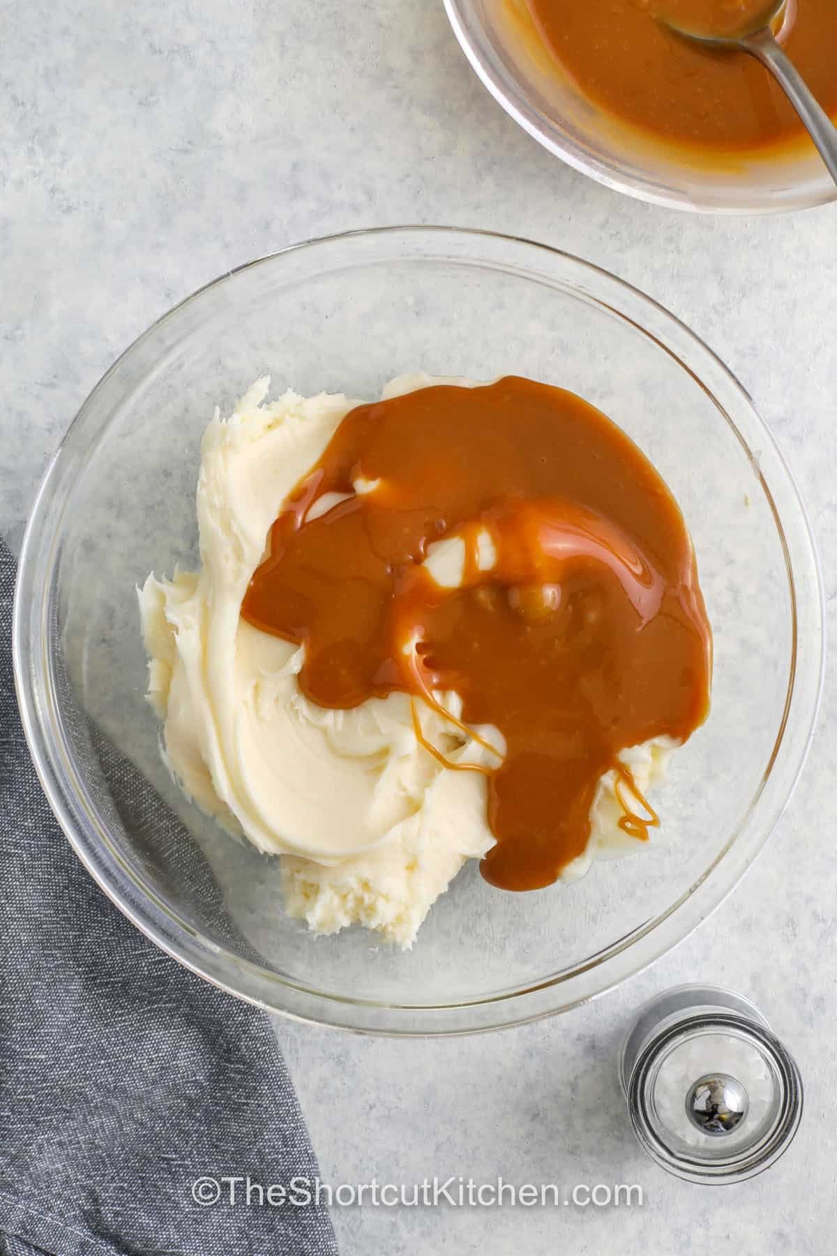 adding caramel to vanilla frosting to make Salted Caramel Cupcakes