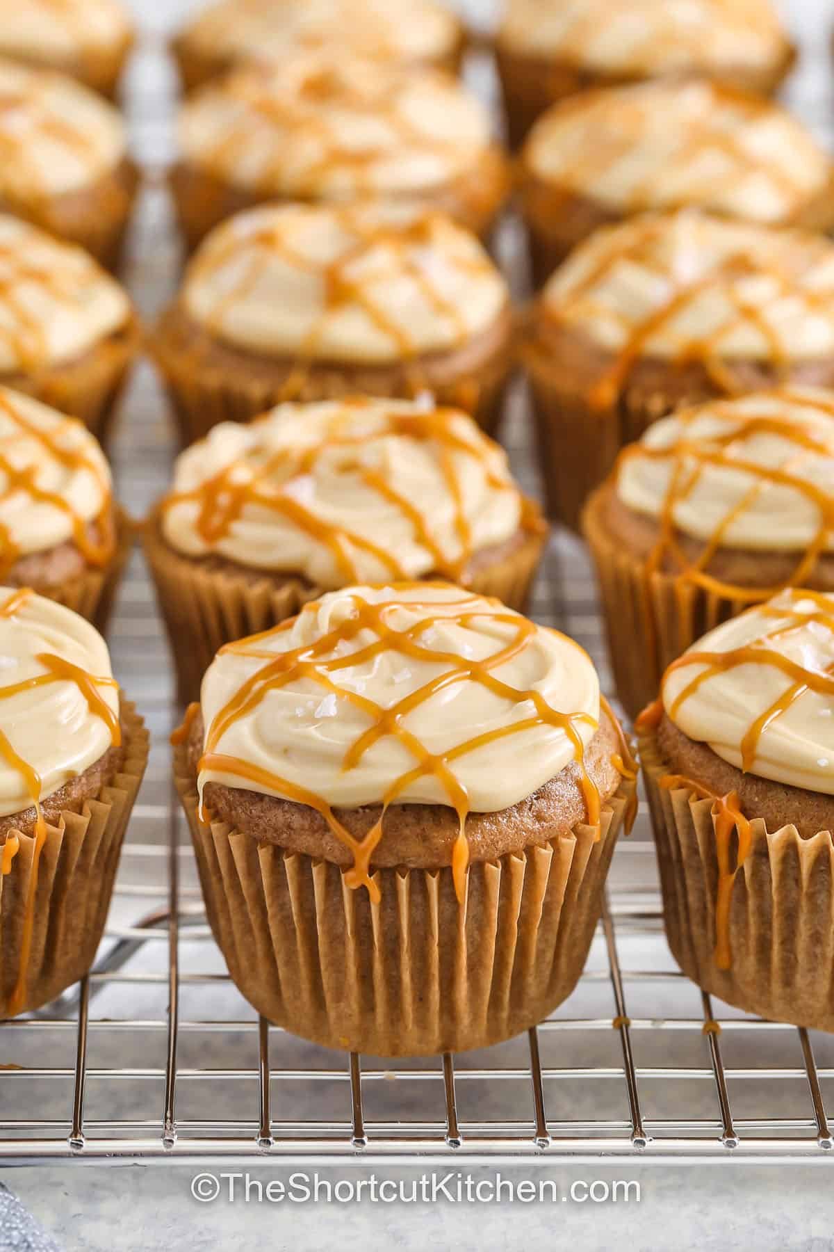 homemade Salted Caramel Cupcakes on a metal rack