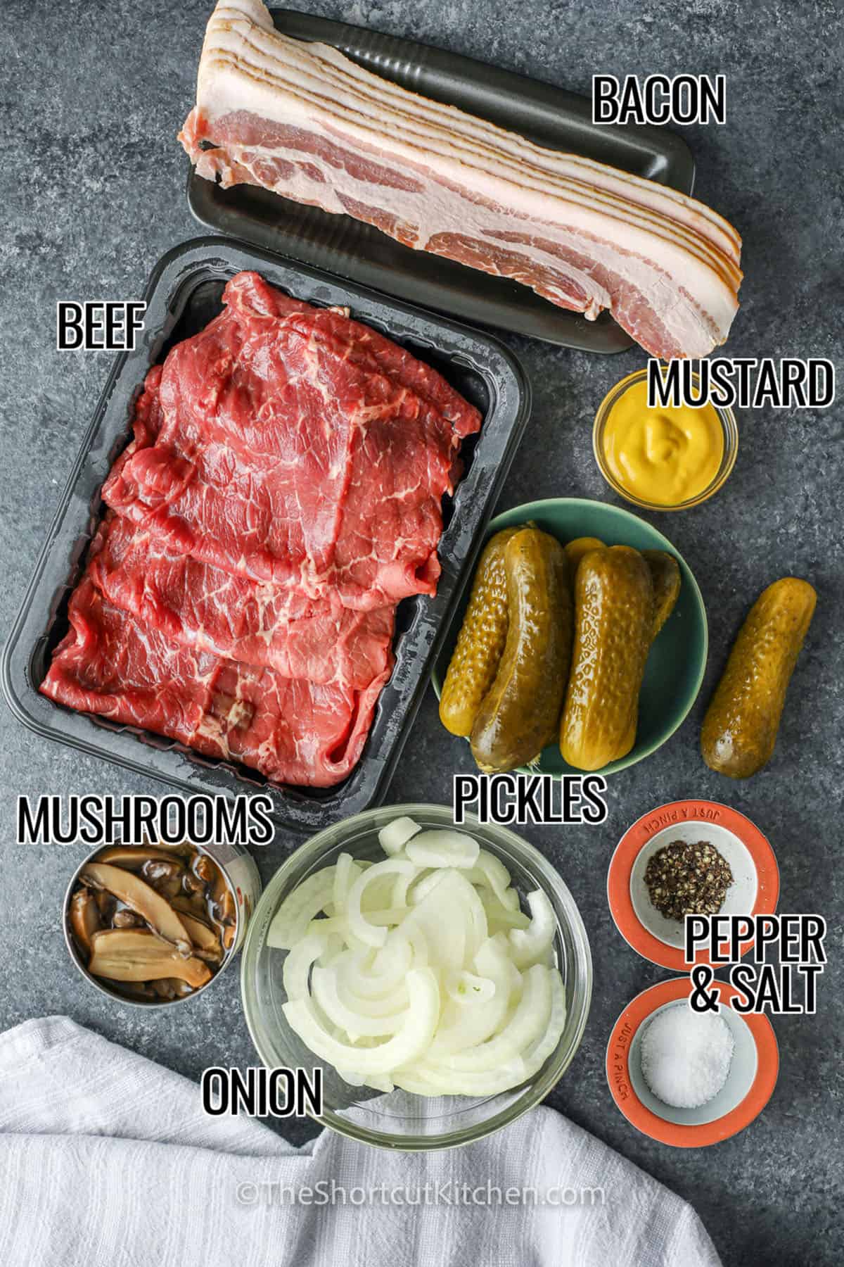 bacon , beef , mustard , pickles , onion , mushrooms , pepper and salt with labels to make Beef Rouladen