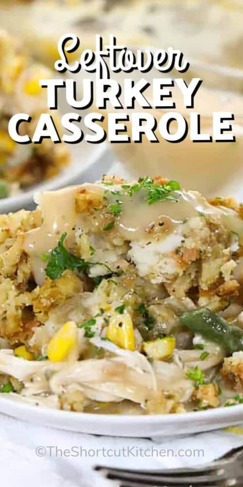 Leftover turkey casserole transforms simple ingredients into a hearty, comforting meal. It combines tender shredded turkey with crisp celery, savory onions, and a rich, flavorful gravy that soaks into every bite. Topped with creamy mashed potatoes and golden stuffing, it’s a perfect way to use holiday leftovers. It has warmth and flavor in every forkful. #theshortcutkitchen A serving of leftover turkey casserole topped with gravy with a title
