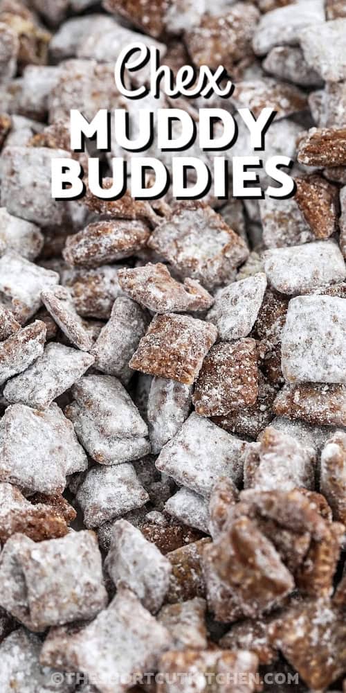 This muddy buddies recipe is the ultimate sweet snack mix that's quick to make and perfect for sharing. With just a handful of ingredients like Chex cereal, chocolate chips, peanut butter, and powdered sugar, it's as easy as microwave, mix, and shake. No baking required. Whether you're prepping for a party, movie night, or holiday treat bags, this recipe is always a crowd-pleaser and ready in minutes. So simple, so addicting. #theshortcutkitchen prepared muddy buddies on a baking sheet with a title