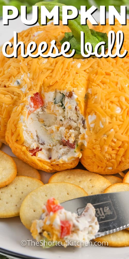pumpkin cheese ball with a scoop on a knife and a title