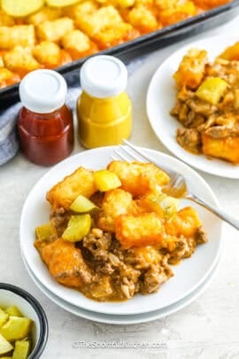 A serving of cheeseburger tater tot casserole on a plate