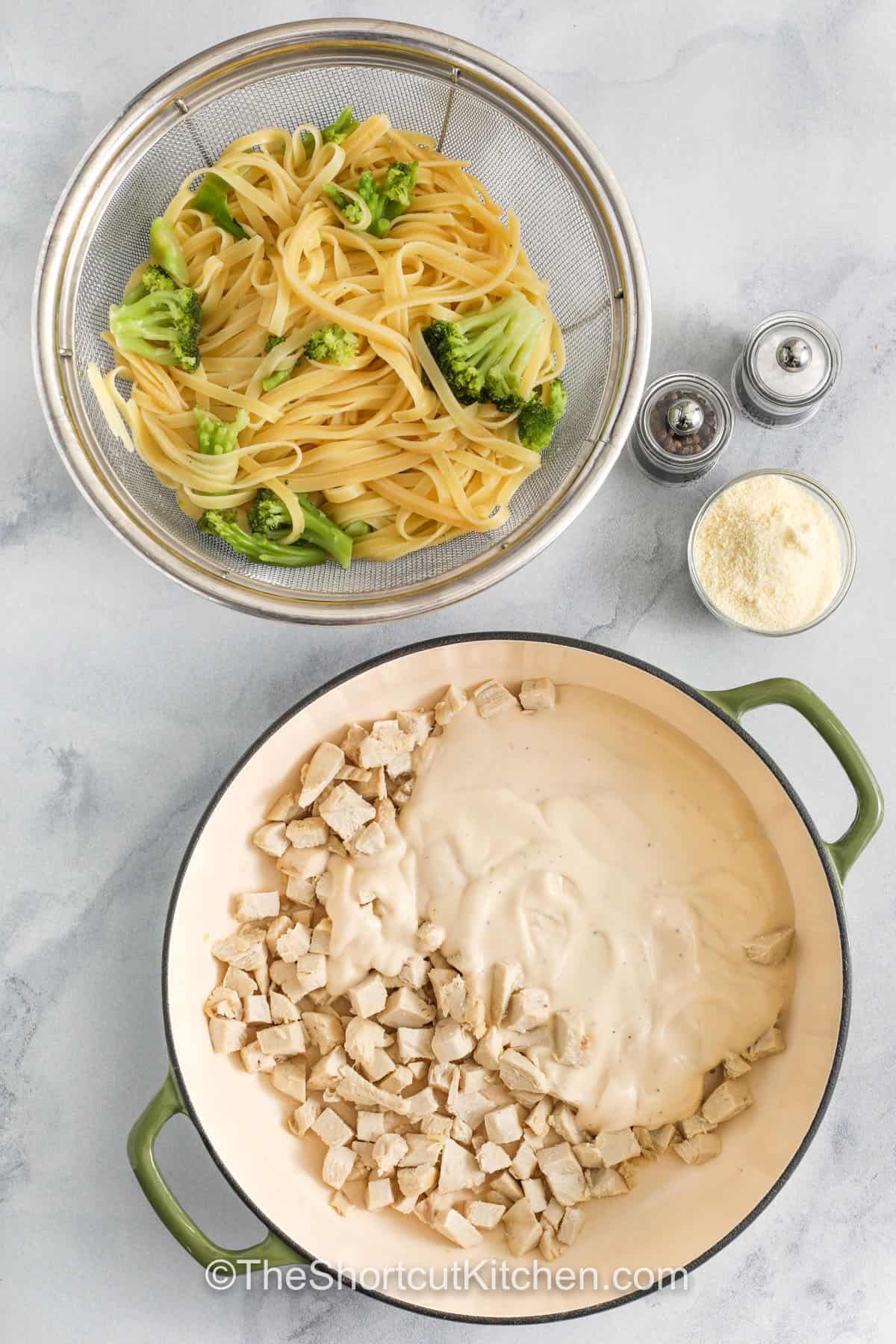 Chicken Alfredo with broccoli is a quick, comforting meal that your family will request over and over again. Tender pasta, succulent chicken, and crisp-tender broccoli come together in a rich, cheesy Alfredo sauce, creating a dish that feels indulgent while still sneaking in some veggies. It’s simple, satisfying, and perfect for busy weeknights or last-minute dinners. #theshortcutkitchen cooked pasta and broccoli in a strainer and a pot of chicken and alfredo sauce