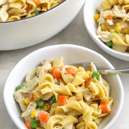 plated Chicken Pot Pie Pasta with pot full in the back