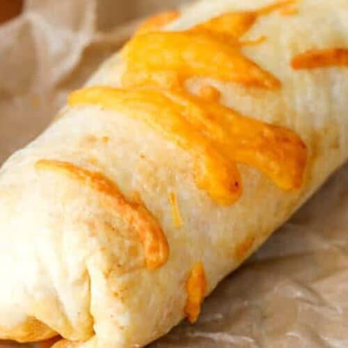 Baked taco pocket topped with cheese