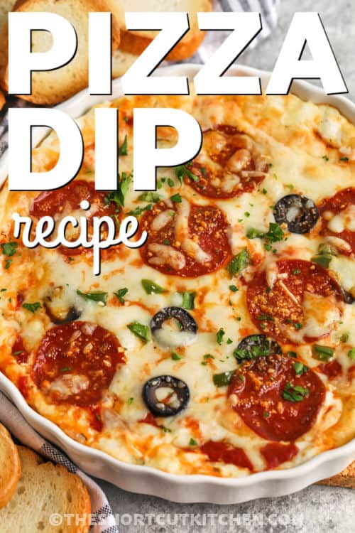 Try this pizza dip recipe for the best easy appetizer that tastes just like your favorite pizza. It’s creamy, cheesy, and hot, with rich layers of garlic, sauce, and pepperoni. Make it in one dish and serve it straight from the oven for a warm, bubbly dip everyone will love. Simple to prepare and fun to eat, it’s the perfect recipe for any occasion. #theshortcutkitchen cheesy Pizza Dip Recipe in a bowl with a title