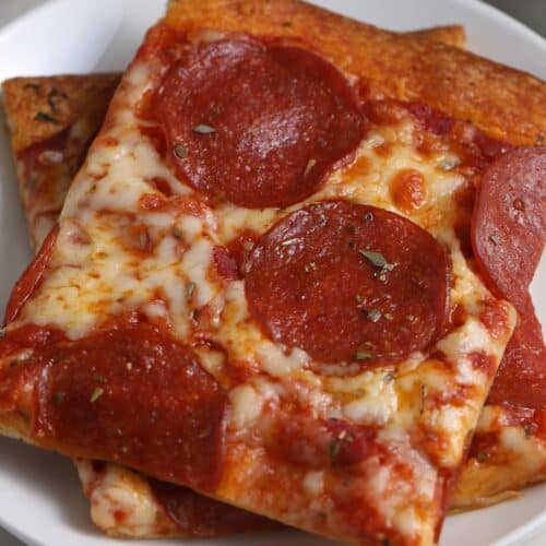 two slices of crescent roll pizza on a plate