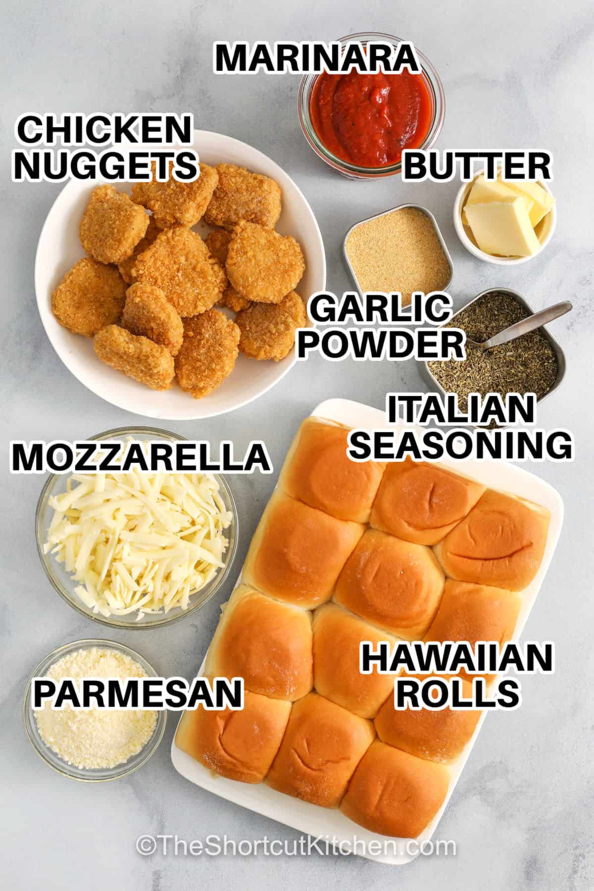 These chicken parm sliders are an easy, crowd-pleasing twist on the classic, made with crispy chicken, melty cheese, and garlicky pull-apart rolls. Sweet Hawaiian rolls balance savory marinara, while mozzarella and parmesan deliver that familiar Italian comfort. Perfect for weeknights, game days, or casual gatherings, they come together quickly with freezer-friendly shortcuts and simple pantry ingredients. Serve warm with extra sauce for dipping and watch them disappear fast. #theshortcutkitchen chicken parm sliders with labelled ingredients