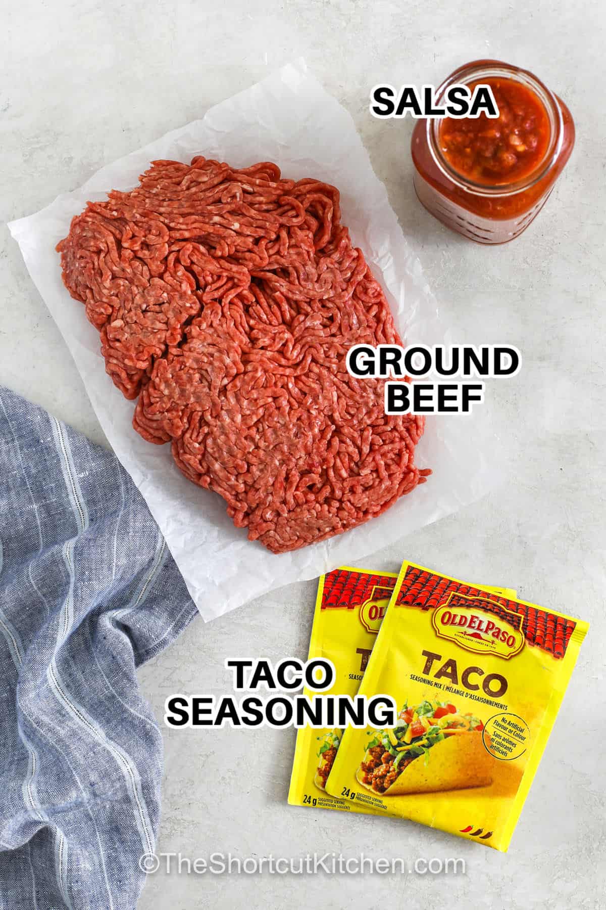 This Crockpot taco meat is made with lean ground beef, taco seasoning, and your favorite salsa. This makes a bold, flavorful taco filling that requires almost no prep. It cooks tender and juicy, making it perfect for tacos, nachos, burrito bowls, salads, or meal prep. A simple three-ingredient recipe that stretches to feed a crowd, and makes weeknight dinners incredibly easy. #theshortcutkitchen salsa , ground beef and taco seasonings with labels to make Crockpot Taco Meat