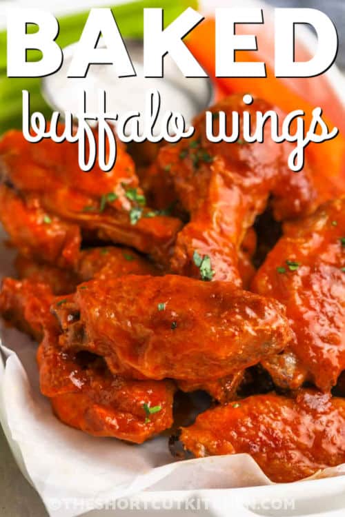 Skip all the mess and make Baked Buffalo Wings that are sure to as good as your favorite wing spot. Coat chicken wings with pantry seasonings, bake extra hot until crisp, then toss in a quick buffalo sauce made with hot sauce and melted butter. This oven-baked buffalo wings recipe is ideal for parties, game day, or an easy dinner. Add extra cayenne for heat or keep it mild; the choice is yours. #theshortcutkitchen baked buffalo wings on a plate with dip and celery in the background and writing