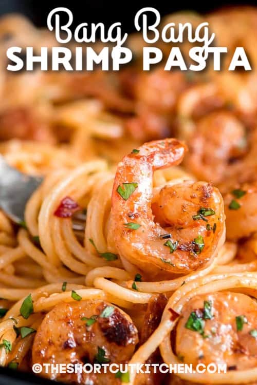 Make Bang Bang Shrimp Pasta when you want a creamy shrimp pasta dinner with bold flavor and minimal work. Quick-seared garlic butter shrimp meets a no-cook bang bang sauce made with mayo, Thai sweet chili, lime juice, and sriracha. Toss with spaghetti, sprinkle with cilantro, and adjust heat with red pepper flakes. This easy weeknight pasta dinner is done fast and disappears even faster. Use frozen peeled shrimp to make it even quicker and easier. #theshortcutkitchen bang bang shrimp pasta with text