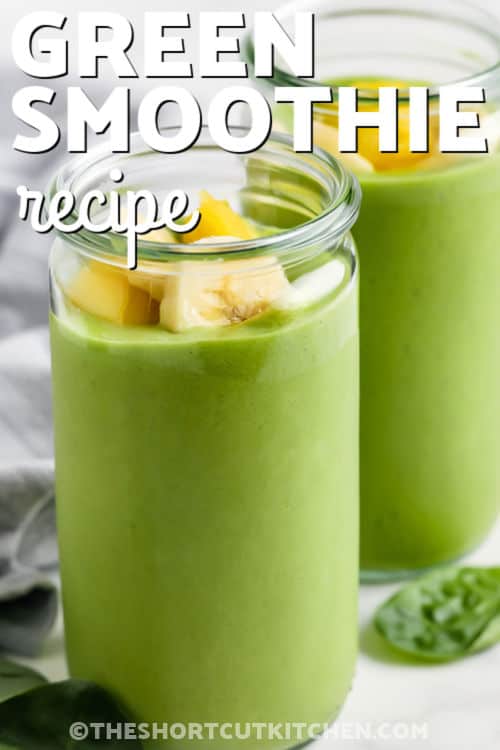 This Green Smoothie Recipe blends baby spinach, pineapple, banana, and yogurt into a creamy, refreshing drink. It’s a quick, nutritious breakfast made with simple ingredients and frozen fruit for easy prep. This tasty smoothie is sweet and simple, and perfect for mornings when you need something quick to make and delicious. #theshortcutkitchen glasses of Green Smoothie Recipe with writing