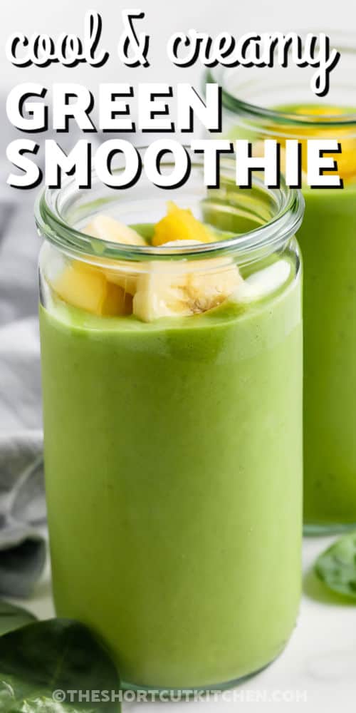 Make this creamy Green Smoothie Recipe with spinach, pineapple, banana, and vanilla yogurt. A smooth and naturally sweet breakfast smoothie, this sweet breakfast or post workout snack blends in minutes. It uses everyday ingredients for a nutritious grab and go treat that you’ll make again and again. #theshortcutkitchen cool and creamy Green Smoothie Recipe in glasses with banana slices and writing