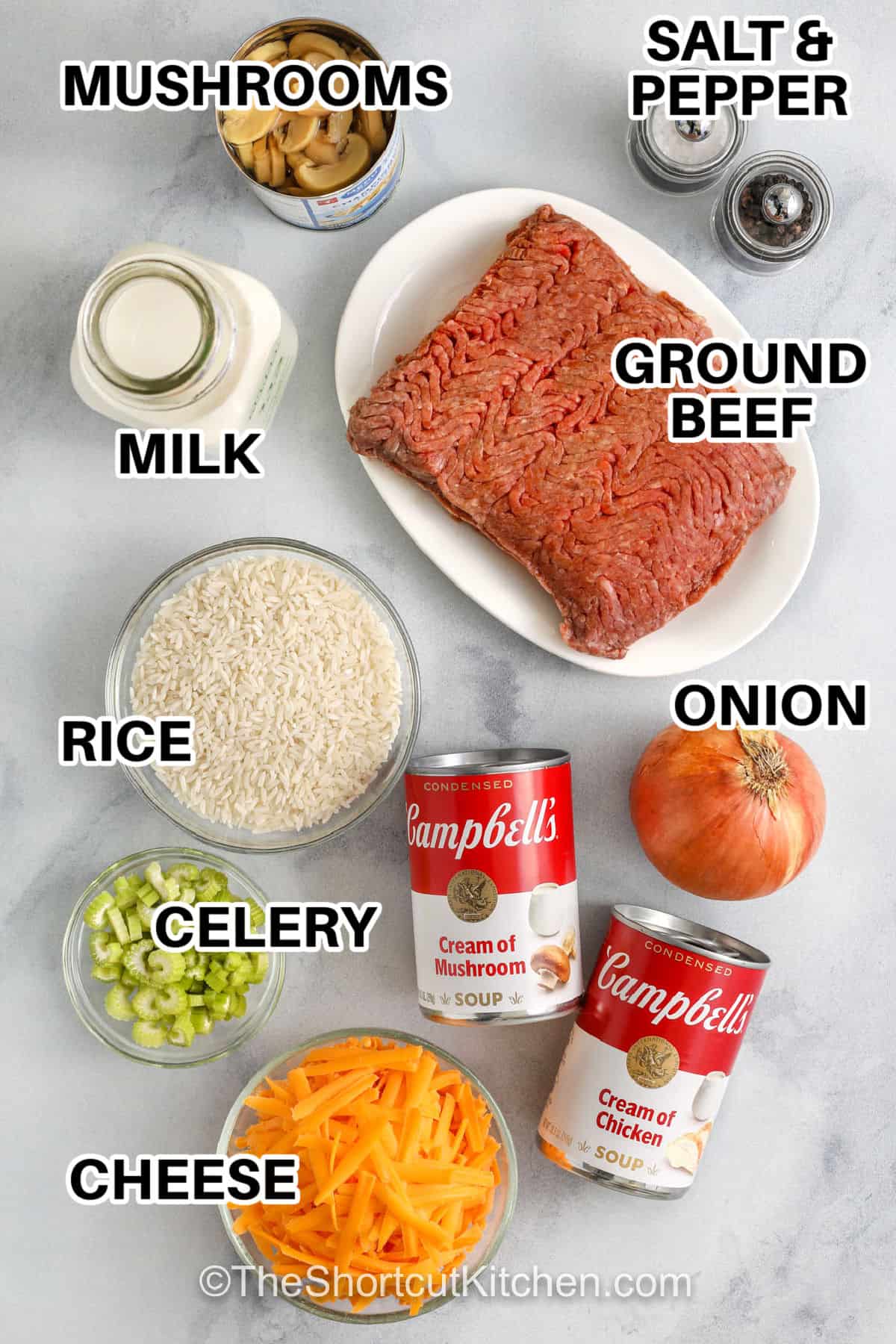 Hamburger rice casserole is the ultimate easy weeknight casserole. Ground beef and rice bake together in a creamy sauce made with condensed soups and milk, then get topped with shredded cheddar cheese for a cheesy, bubbly finish. This ground beef and rice casserole is simple, filling, and perfect for making ahead. Add mushrooms or frozen veggies for an easy variation. #theshortcutkitchen mushrooms , milk , ground beef , rice , celery , cheese , onion , cream of mushroom soup , cream of chicken soup , salt and pepper with labels Hamburger Rice Casserole