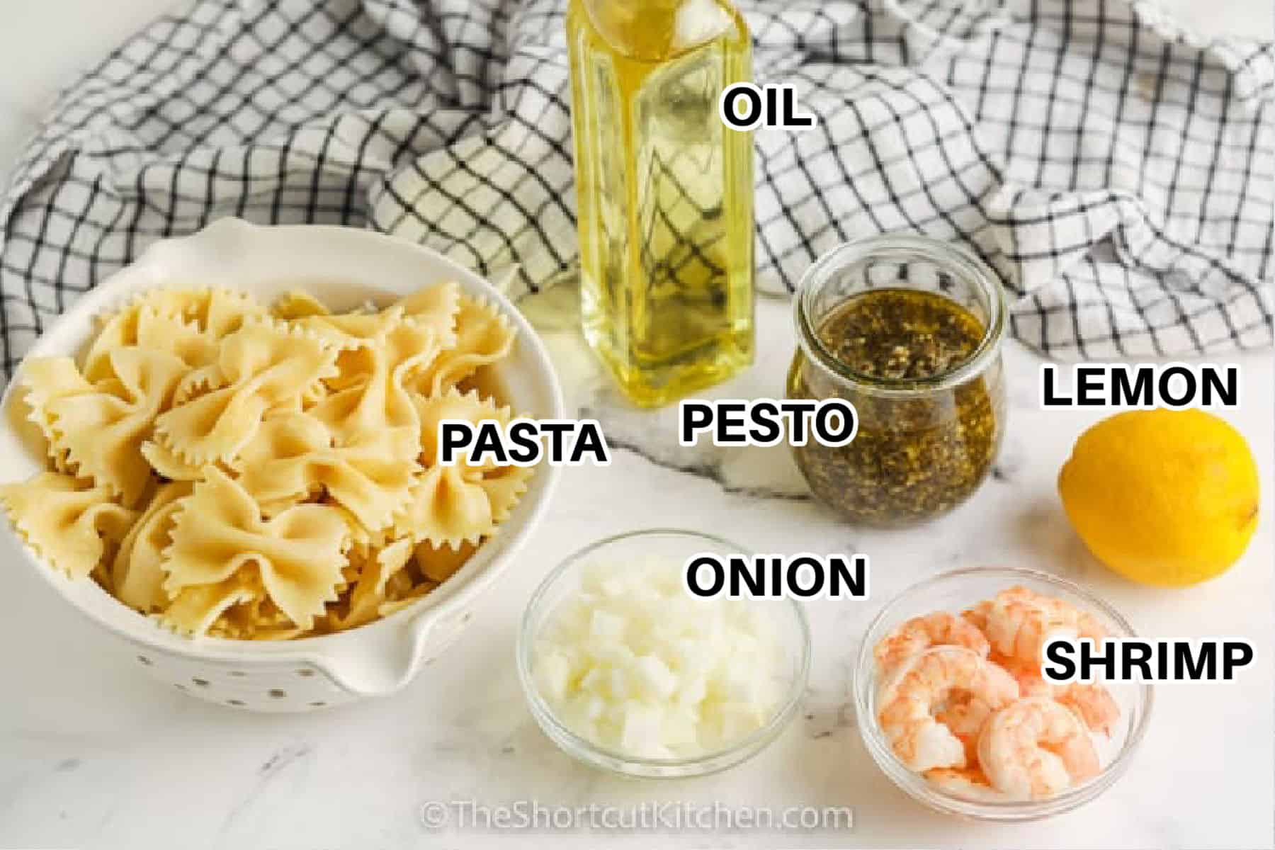 Shrimp Pesto Pasta is a quick and chic weeknight dinner that delivers big flavor. Cook your pasta, warm cooked shrimp with onion, then toss it all with basil pesto sauce and lemon zest. Add reserved pasta water a splash at a time so the sauce coats evenly. Finish with parmesan and fresh basil. This shrimp pesto pasta recipe is easy, customizable, and perfect when time is tight. Ready in 25 minutes, it’s the best shortcut recipe. #theshortcutkitchen pasta , pesto , oil , onion , lemon , shrimp with labels to make Shrimp Pesto Pasta