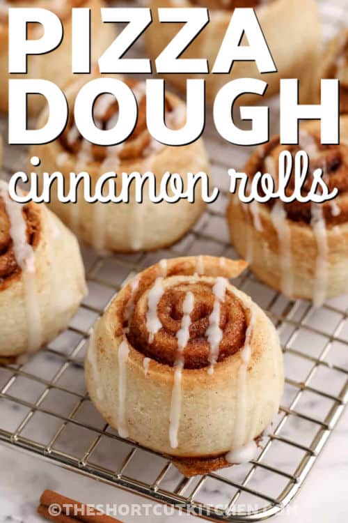 Pizza Dough Cinnamon Rolls are the ultimate shortcut breakfast. Use Pillsbury pizza dough or swap in crescent roll dough. Spread softened butter, add brown sugar and cinnamon, roll, slice, and bake in a 9×9 pan until golden. Finish with a quick cinnamon roll glaze for warm, cinnamon roll comfort that’s ready to enjoy in under an hour. #theshortcutkitchen Pizza Dough Cinnamon Rolls with icing on a cooling rack with a title
