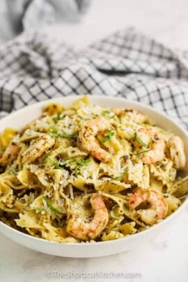shrimp pasta in a bowl with pesto
