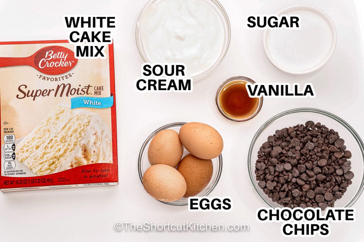 Chocolate chip bundt cake turns everyday pantry staples into a dessert that looks bakery special. The batter comes together quickly and bakes into a rich, fluffy cake packed with chocolate chips from edge to center. Each slice is full of flavor with just the right balance of sweetness and vanilla. Dress it up with powdered sugar or drizzle with glaze for an easy dessert that always impresses guests. #theshortcutkitchen white cake mix , sour cream , eggs , vanilla , sugar , chocolate chips with labels to make Chocolate Chip Bundt Cake