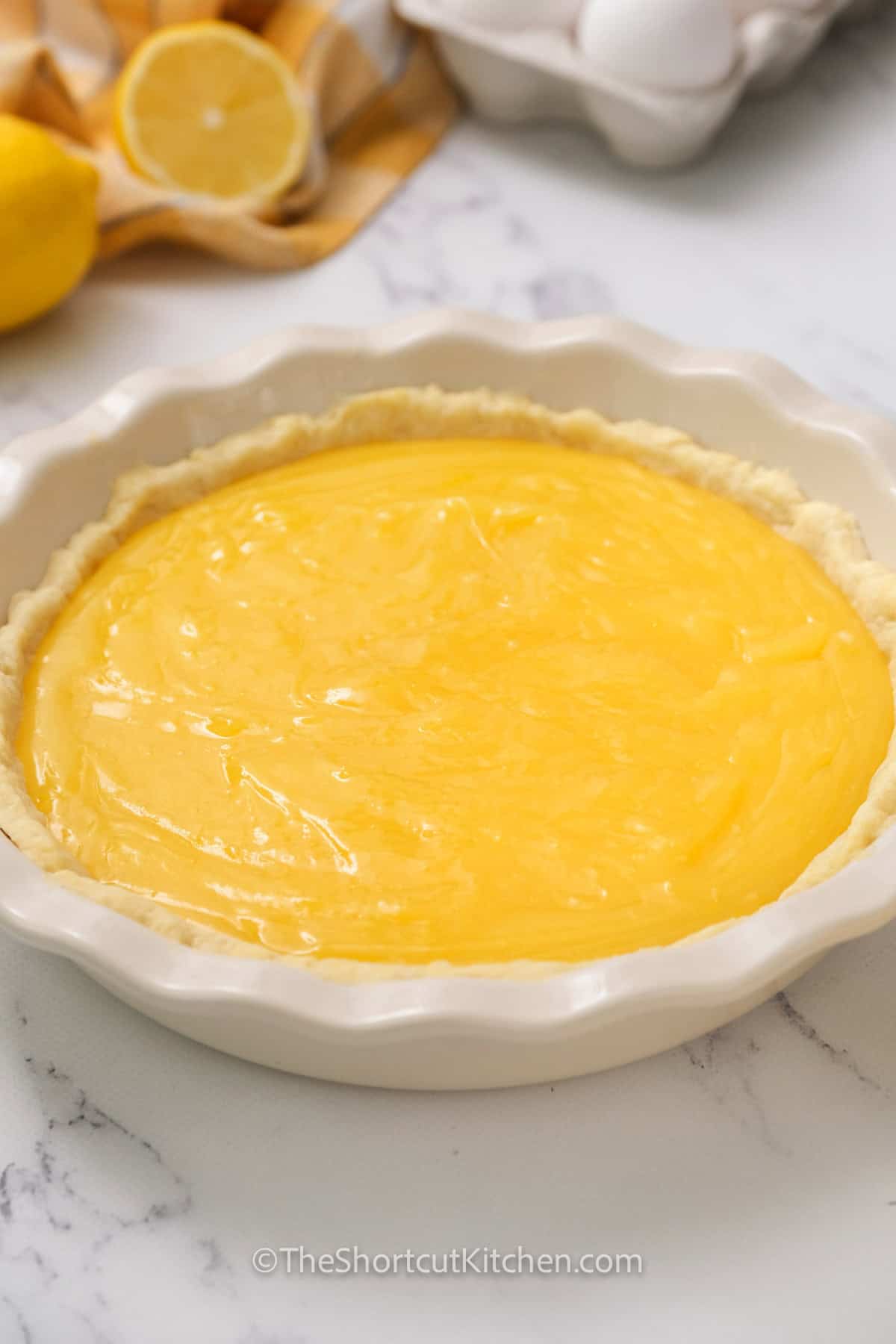 This lemon meringue pie with pie filling uses a pre-made crust plus canned lemon creme filling for a fast, reliable shortcut. The 3-ingredient meringue whips up fluffy and bakes into golden peaks. Seal the meringue to the crust edge to help prevent shrinking, then chill well for neat wedges. Sweet, tangy, creamy, and so easy. #theshortcutkitchen Lemon Meringue Pie in a dish