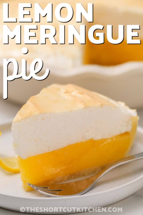 Make lemon meringue pie with pie filling in a fraction of the time. Use canned lemon filling for the creamy layer, then whip a classic meringue topping until glossy and stiff. Spread it to touch the crust edges and bake until golden. Chill well and slice for an easy, sweet-tart dessert that looks impressive for holidays and gatherings. #theshortcutkitchen slice of Lemon Meringue Pie on a plate with a fork and a title