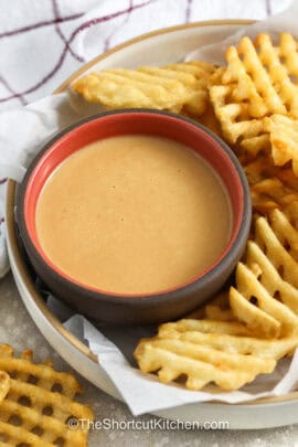 chick-fil-a sauce recipe in a bowl with waffle fries on the side for dipping