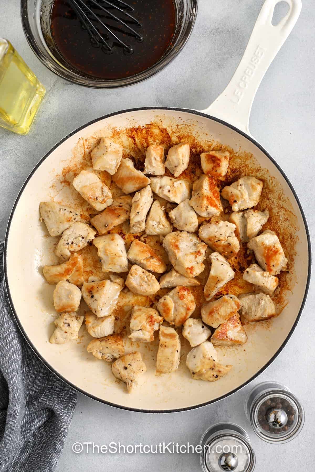 Honey teriyaki chicken is a skillet dinner that brings sweet and savory flavors to the table. Bite sized chicken cooks until golden, then simmers in a glossy honey teriyaki sauce made with bottled teriyaki, garlic, and rice vinegar. The sauce thickens into a rich glaze that coats every piece of chicken. This easy chicken dinner uses simple ingredients and works well with rice, noodles, or vegetables for a satisfying meal. #theshortcutkitchen cooked chicken to make Honey Teriyaki Chicken