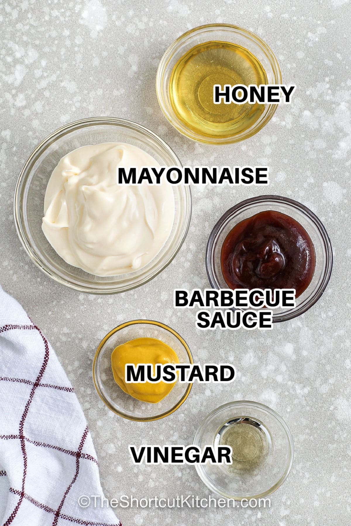 Chick-Fil-A sauce recipe lovers will want to try this easy homemade dip that tastes just like the classic favorite. With simple ingredients like mayo, honey, mustard, and BBQ sauce, this copycat Chick-Fil-A sauce recipe delivers that smooth and creamy texture with a sweet and smoky finish. It is perfect for dipping chicken strips, fries, or spreading on burgers and wraps. Keep a jar ready in the fridge to make everyday meals a little more exciting. #theshortcutkitchen ingredients with labels to make chick-fil-a sauce recipe