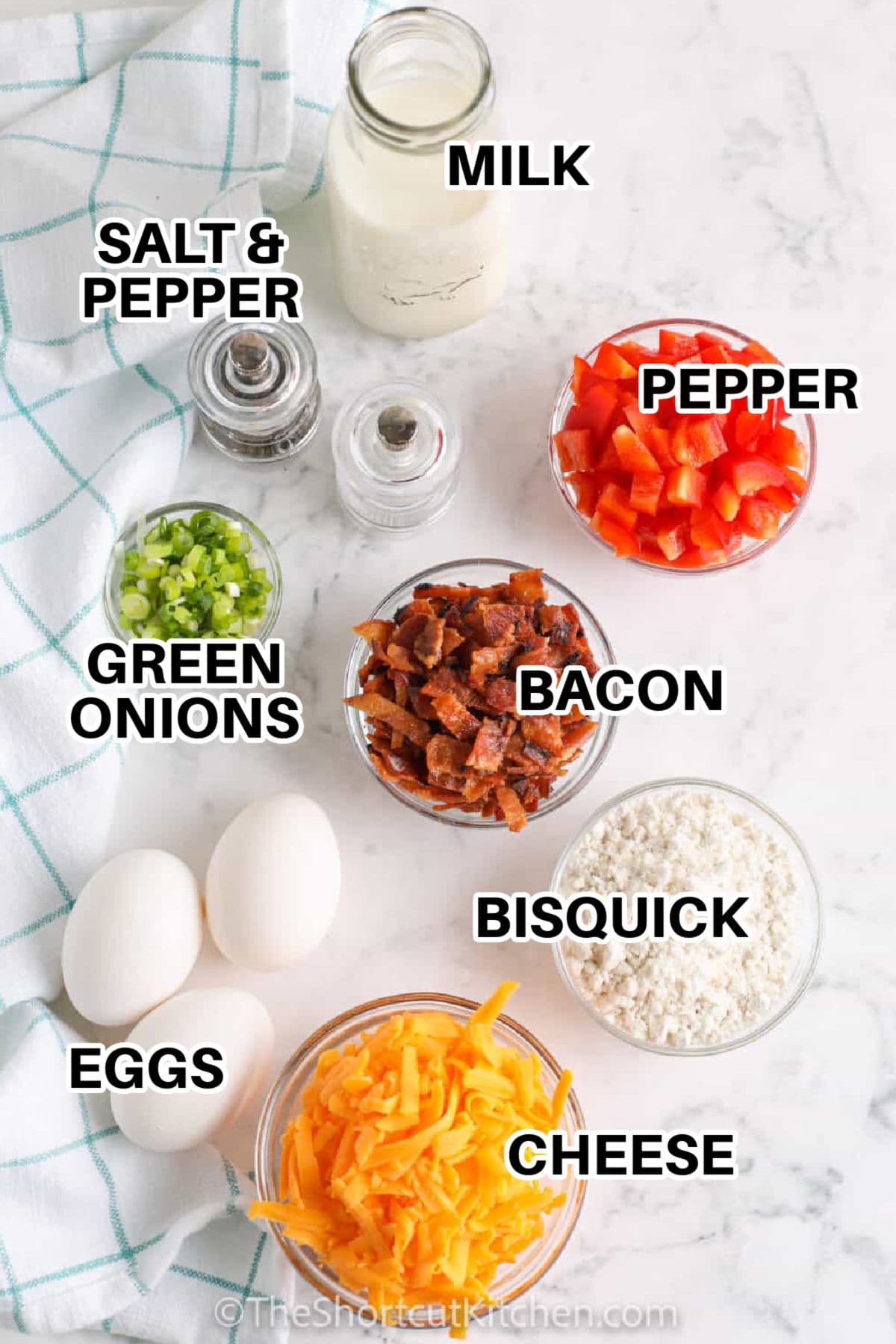 Crustless bacon quiche is a simple Bisquick crustless quiche with crispy bacon, cheddar cheese, eggs, milk, green onions, and peppers. It has all the savory flavor of a bacon quiche recipe without the extra step of making a crust. This easy baked breakfast recipe is perfect for brunch guests or slicing up for leftovers during the week. #theshortcukitchen labelled ingredients