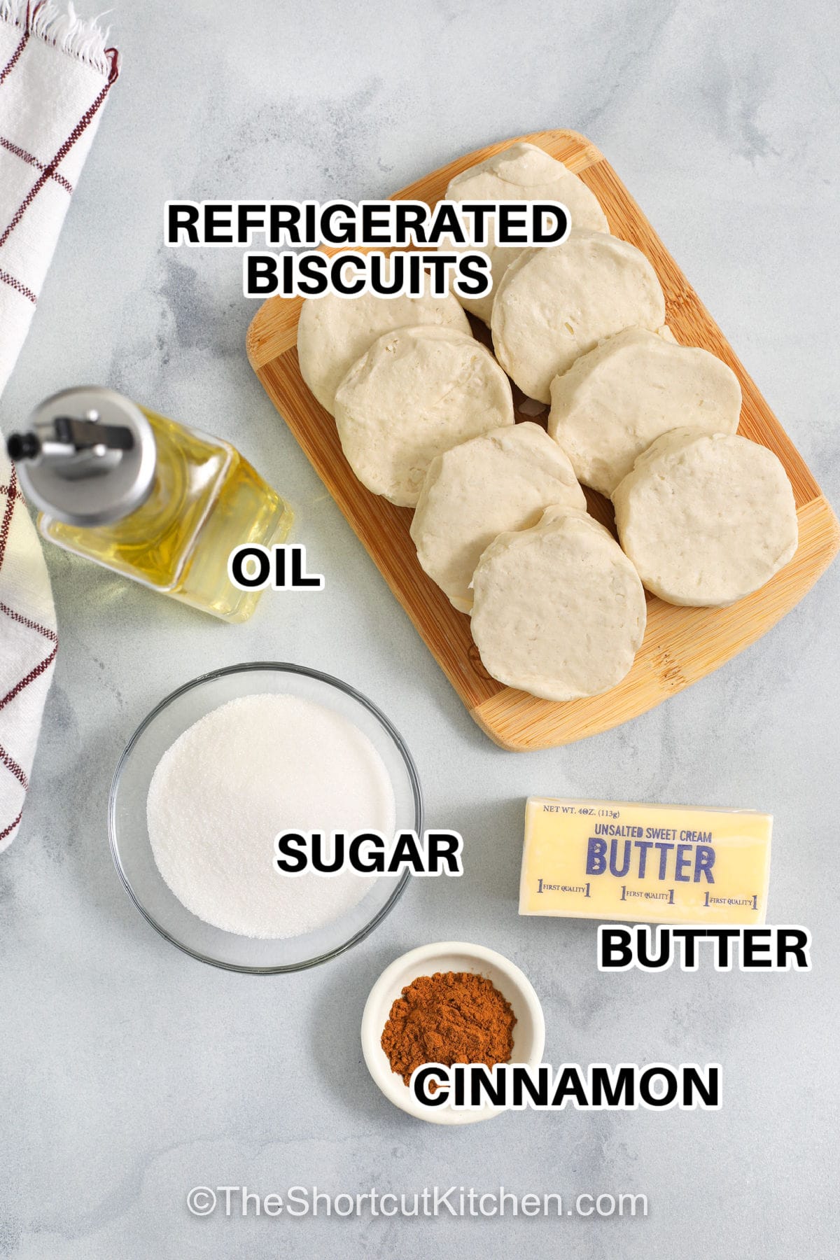 Homemade donuts do not have to be complicated. This easy donut recipe makes biscuit donuts from canned refrigerated biscuits, coated in buttery cinnamon sugar for a cozy treat. Fry at the right temperature for golden color and less grease, or use the air fryer donuts option. Finish with vanilla glaze or chocolate glaze and enjoy donut holes, too. #theshortcutkitchen labelled ingredients for donuts