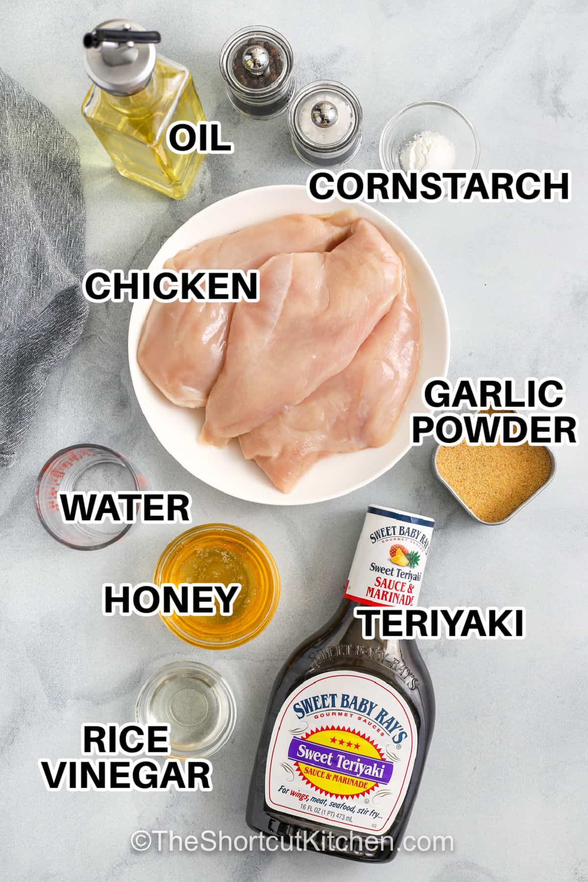 Honey teriyaki chicken is an easy chicken dinner with a rich, sweet and savory sauce. Bite sized chicken cooks in a skillet and is simmered in a glossy honey teriyaki sauce made with bottled teriyaki, garlic, and rice vinegar. The sauce thickens into a rich glaze that coats every piece of chicken. Serve this homemade teriyaki chicken recipe over rice, noodles, or vegetables for a satisfying meal made with simple pantry ingredients. #theshortcutkitchen oil , cornstarch , chicken , garlic powder , water , honey , teriyaki sauce , rice vinegar with labels to make Honey Teriyaki Chicken