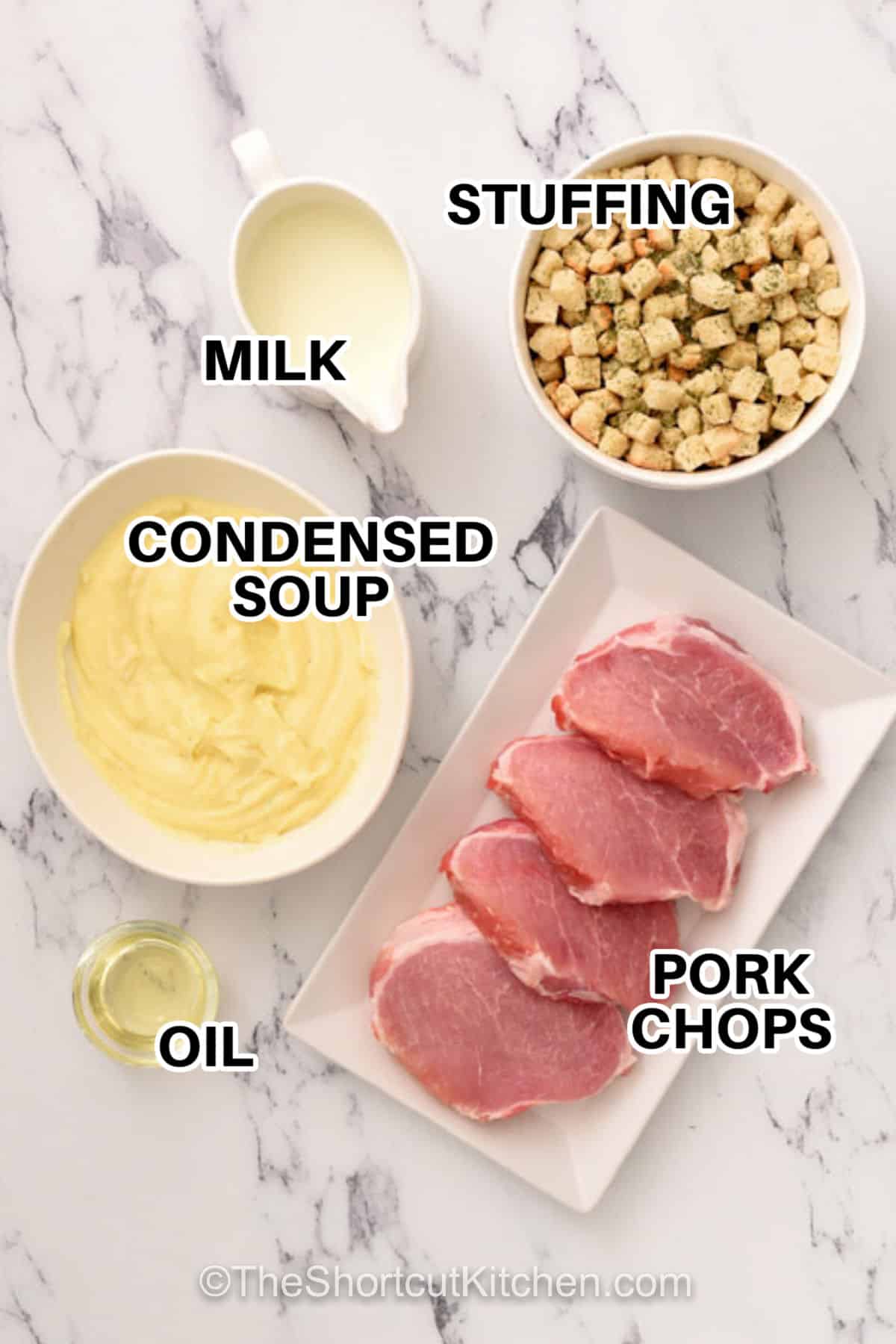 Say goodbye to dry meat with these easy smothered pork chops. Seared to perfection then baked under a layer of herb stuffing and cream of chicken soup, these chops stay tender and juicy. It is a 5-ingredient meal that the whole family will ask for again and again. #theshortcutkitchen milk , stuffing, condensed soup , oil , pork chops with labels to make Smothered Pork Chops Recipe