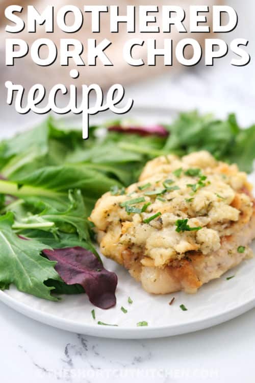 Tender, creamy, and savory, this smothered pork chops recipe is a must-try. This baked casserole uses a clever stuffing shortcut to save time without sacrificing flavor. It is a hearty, 5-ingredient dinner that makes feeding a crowd simple and delicious. #theshortcutkitchen Smothered Pork Chops Recipe with salad and a title