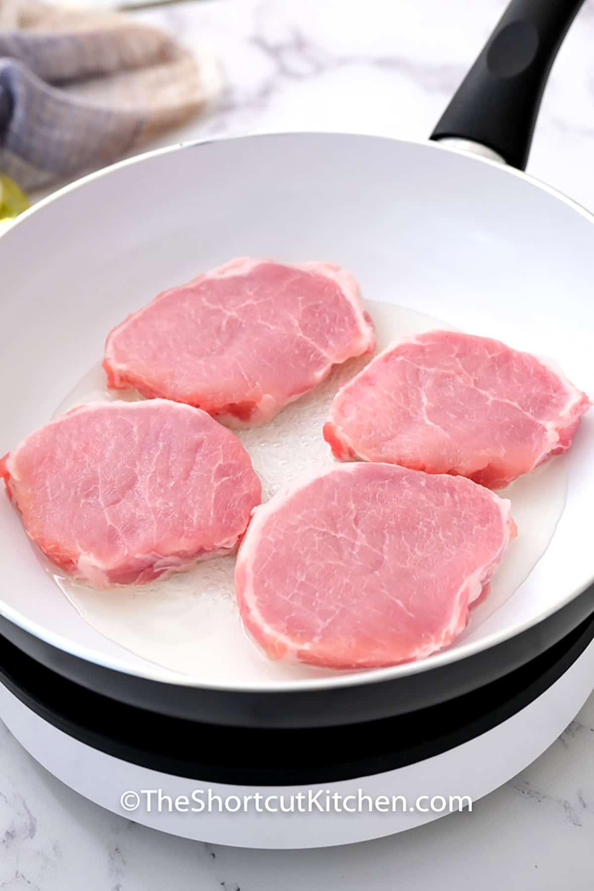 Elevate your pork dinner with this smothered pork chops recipe. The combination of savory stuffing and a velvety cream of mushroom sauce ensures every bite of the thick-cut pork is moist and flavorful. It is a simple, beginner-friendly recipe that delivers big results. #theshortcutkitchen cooking pork chops to make Smothered Pork Chops Recipe