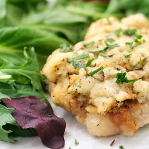 close up of plated Smothered Pork Chops Recipe with salad