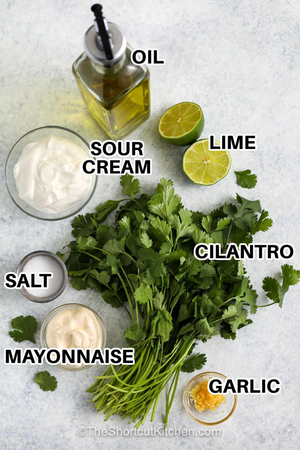 Cilantro garlic sauce is creamy, zesty, and full of bold garlic flavor. This easy cilantro sauce recipe mixes simple ingredients into a smooth and versatile topping. Drizzle it over burrito bowls, grilled steak, or roasted vegetables for a fresh finish. It also works as a dip for chips or a spread for sandwiches and wraps. Keep it on hand to upgrade any meal. It pairs nicely with both meat and veggie dishes. #theshortcutkitchen oil , lime , sour cream , salt , mayonnaise , cilantro , garlic with labels to make Cilantro Garlic Sauce