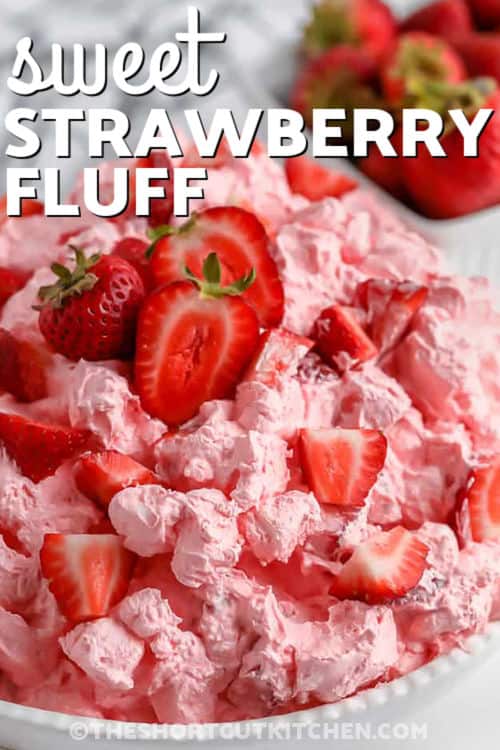 Make strawberry fluff when you want an easy strawberry fluff salad recipe that feels festive without much work. This chilled no-bake dessert is made with strawberry Jello, fresh strawberries, yogurt, mini marshmallows, and whipped topping for a sweet creamy bite. It is a great dessert side dish for parties, potlucks, and family gatherings where simple recipes shine. #theshortcutkitchen sweet Strawberry Fluff in a bowl with writing