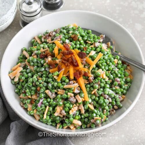 bowl of Pea Salad with Bacon with a spoon