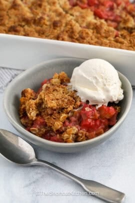 Strawberry Rhubarb Crisp with a scoop of vanilla ice cream on top