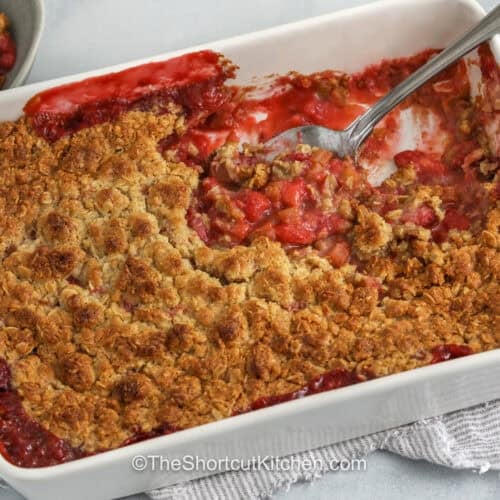 Strawberry Rhubarb Crisp in the dish with a spoon
