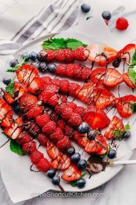 plated of Fruit Kabobs with melted chocolate on top